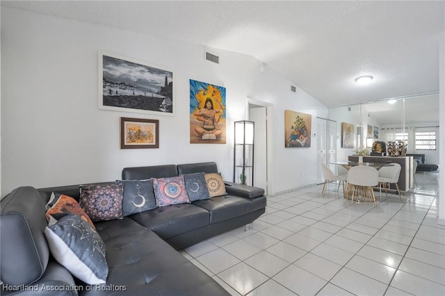 18210 Mediterranean Blvd Unit 5-20, Hialeah, FL 33015 - living area featuring lofted ceiling, light tile patterned floors, and baseboards