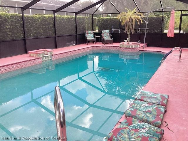 view of swimming pool with a lanai