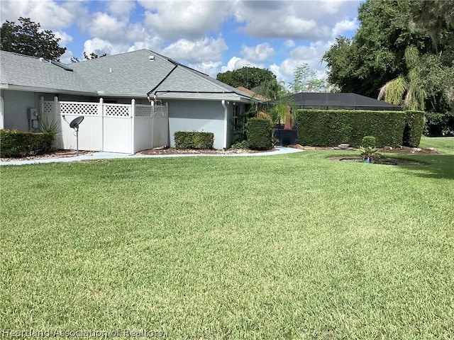 2831 Sunrise Dr, Sebring, FL 33872 - exterior space with a lawn, fence, and stucco siding
