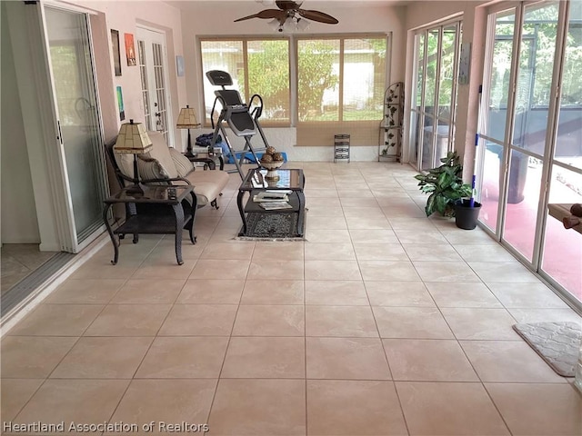 sunroom with ceiling fan and plenty of natural light