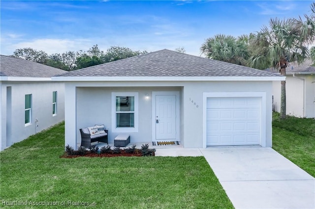 ranch-style home featuring a front yard and a garage