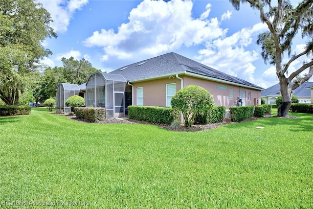 3013 Royal Oaks Ct, Sebring, FL 33875 - view of home's exterior with a lawn, stucco siding, glass enclosure, and roof with shingles