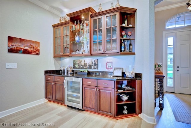3013 Royal Oaks Ct, Sebring, FL 33875 - indoor bar featuring beverage cooler, light wood-style floors, crown molding, and plenty of natural light