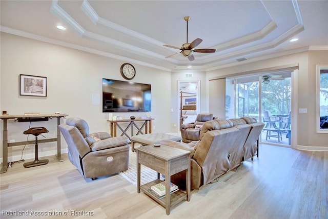 3013 Royal Oaks Ct, Sebring, FL 33875 - living room featuring a ceiling fan, light wood-style flooring, a raised ceiling, crown molding, and recessed lighting