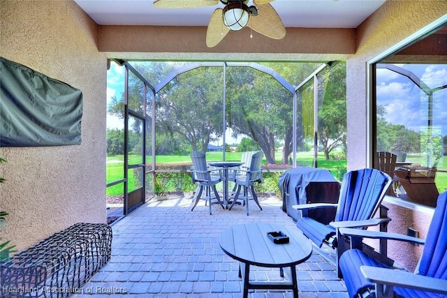 3013 Royal Oaks Ct, Sebring, FL 33875 - sunroom / solarium with a ceiling fan and outdoor dining space