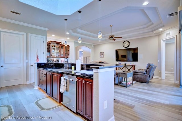 3013 Royal Oaks Ct, Sebring, FL 33875 - kitchen featuring a raised ceiling, a ceiling fan, dishwasher, arched walkways, and dark brown cabinets