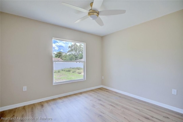 4001 Simca St, Sebring, FL 33872 - unfurnished room featuring wood finished floors, plenty of natural light, and baseboards