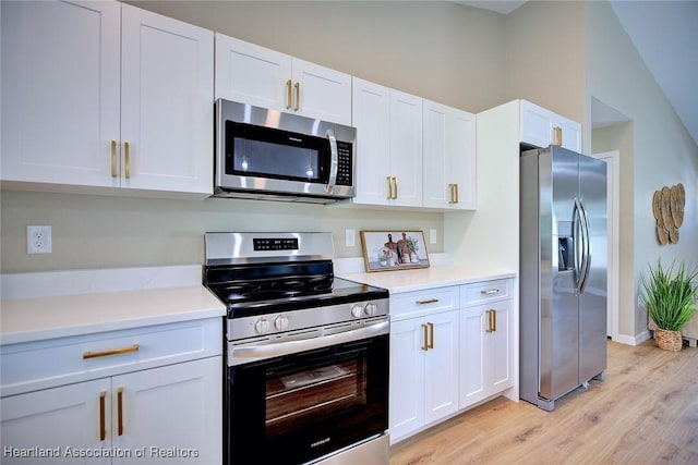 4001 Simca St, Sebring, FL 33872 - kitchen featuring appliances with stainless steel finishes, light wood-style flooring, white cabinetry, and light countertops