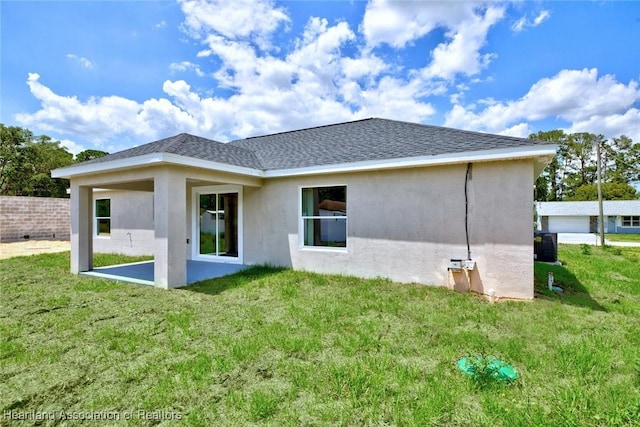 4001 Simca St, Sebring, FL 33872 - back of house featuring stucco siding, a patio area, and roof with shingles