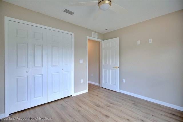 4001 Simca St, Sebring, FL 33872 - unfurnished bedroom with a closet, light wood-style flooring, baseboards, and ceiling fan