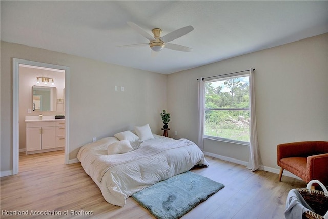 4001 Simca St, Sebring, FL 33872 - bedroom featuring light wood-style flooring, baseboards, ensuite bath, and ceiling fan