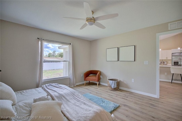 4001 Simca St, Sebring, FL 33872 - bedroom with stainless steel fridge, light wood-style flooring, baseboards, and ceiling fan