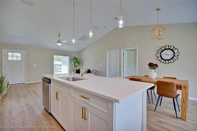4001 Simca St, Sebring, FL 33872 - kitchen with a sink, dishwasher, pendant lighting, light wood-type flooring, and high vaulted ceiling