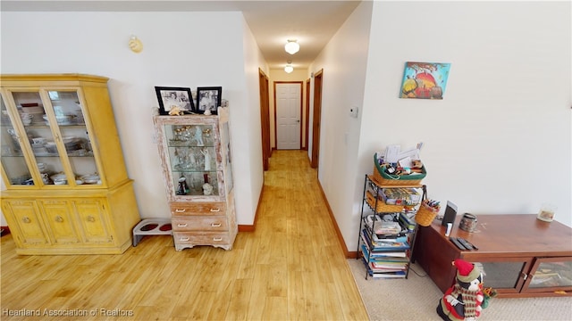 hallway with wood-type flooring