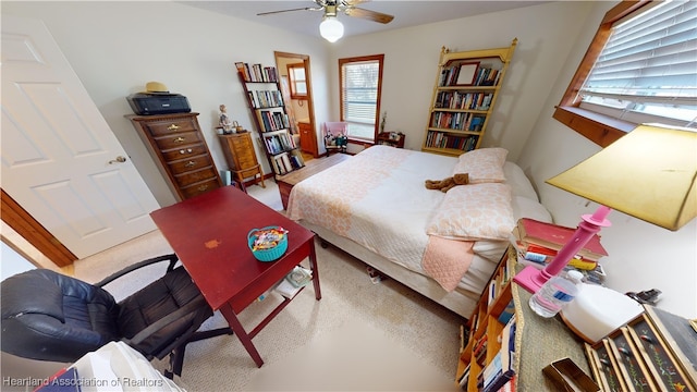 carpeted bedroom featuring ceiling fan