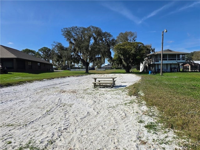 view of property's community with a yard