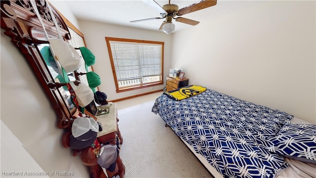 bedroom with ceiling fan and carpet floors