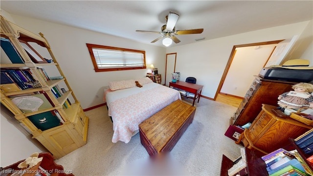 bedroom with light colored carpet and ceiling fan