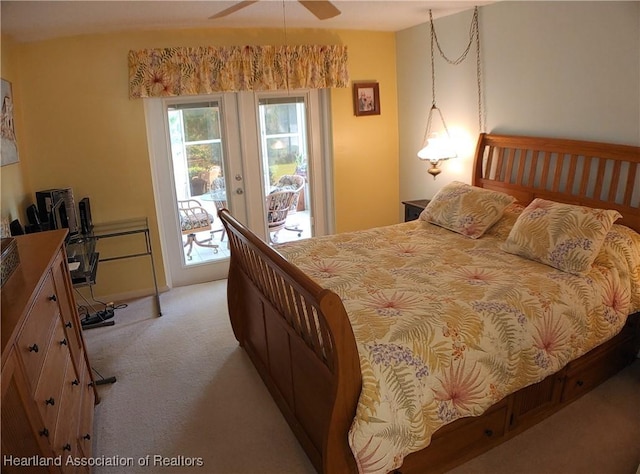 bedroom with access to exterior, french doors, and light carpet