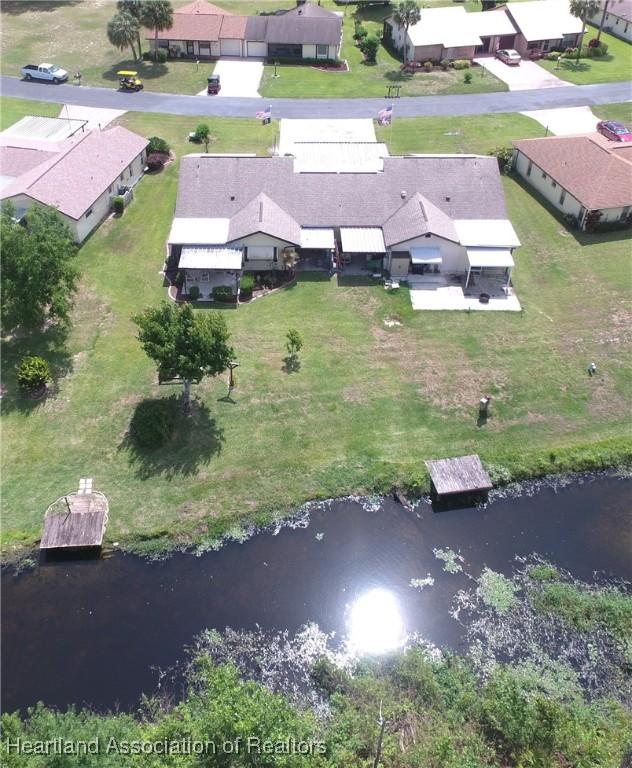 aerial view featuring a residential view and a water view