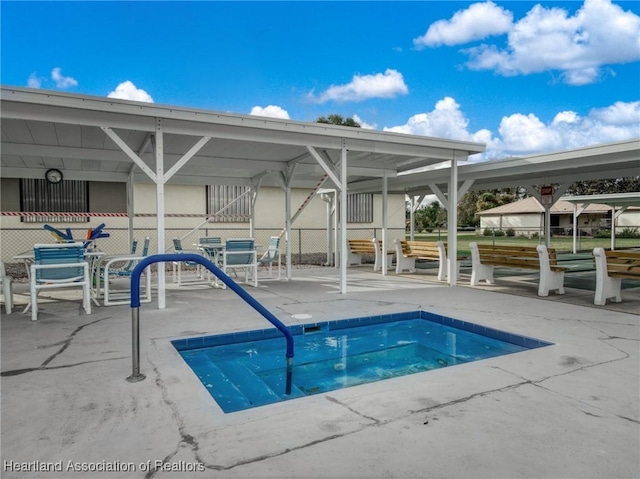 view of pool with a patio area and fence