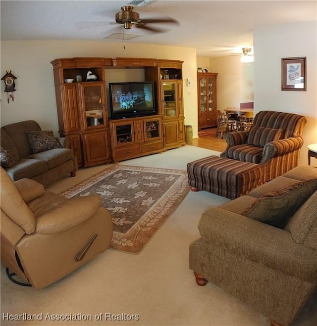 living area with a ceiling fan