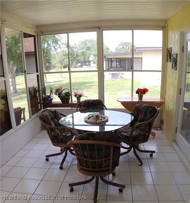 sunroom / solarium featuring a healthy amount of sunlight