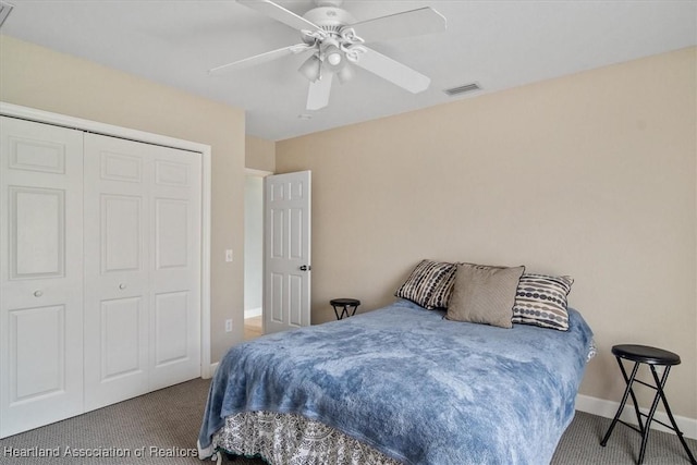 bedroom with ceiling fan, a closet, and carpet