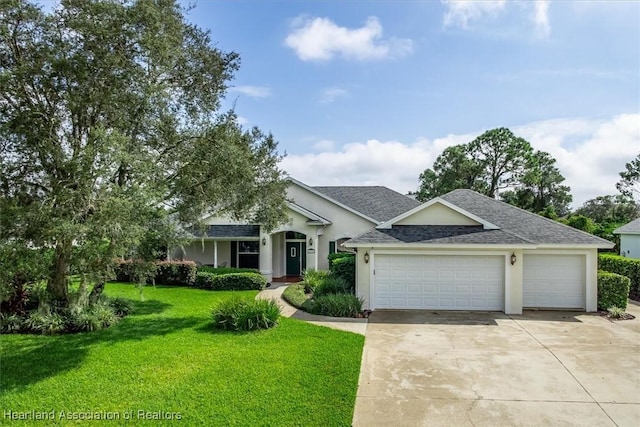 view of front facade with a front yard and a garage