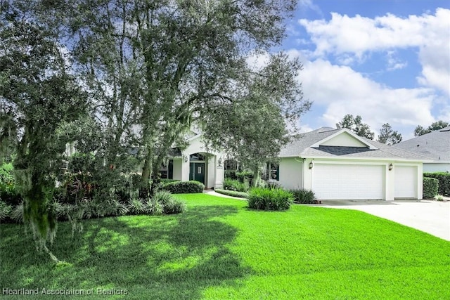 view of front facade featuring a front lawn and a garage