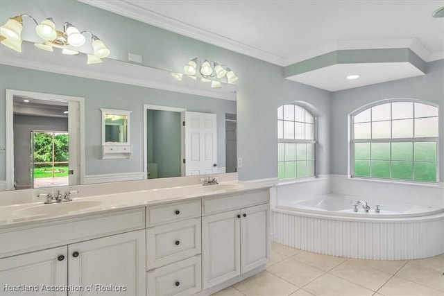 bathroom with tile patterned flooring, vanity, a healthy amount of sunlight, and crown molding