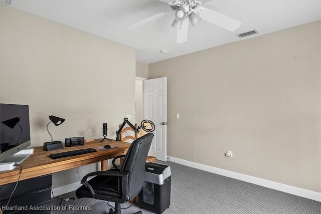 office space with carpet and ceiling fan