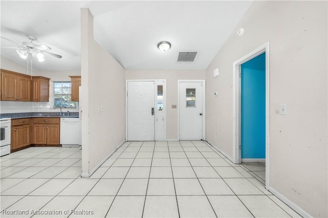 kitchen with ceiling fan, dishwasher, backsplash, vaulted ceiling, and range