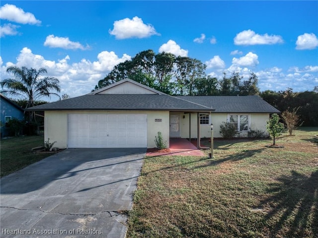 single story home featuring a front yard and a garage