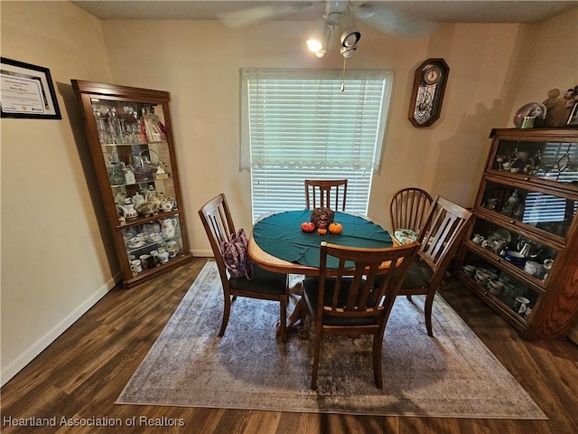 dining area with dark hardwood / wood-style flooring