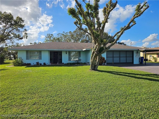 single story home with a front yard and a garage