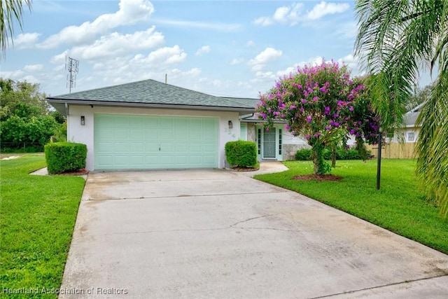 single story home with a garage and a front yard