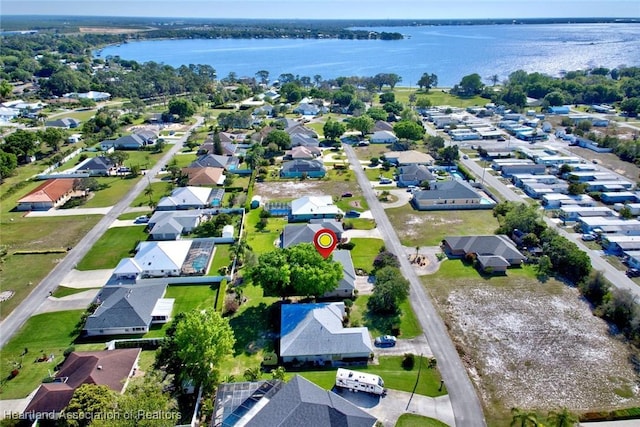 aerial view with a residential view and a water view