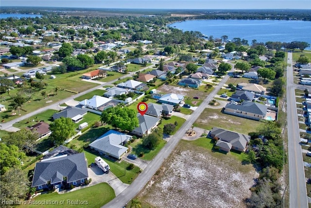 bird's eye view with a residential view and a water view