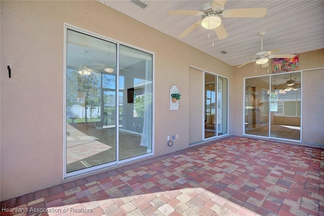 view of patio / terrace with a ceiling fan and visible vents