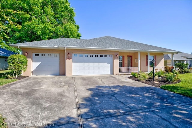 ranch-style house with stucco siding, a garage, a porch, and driveway