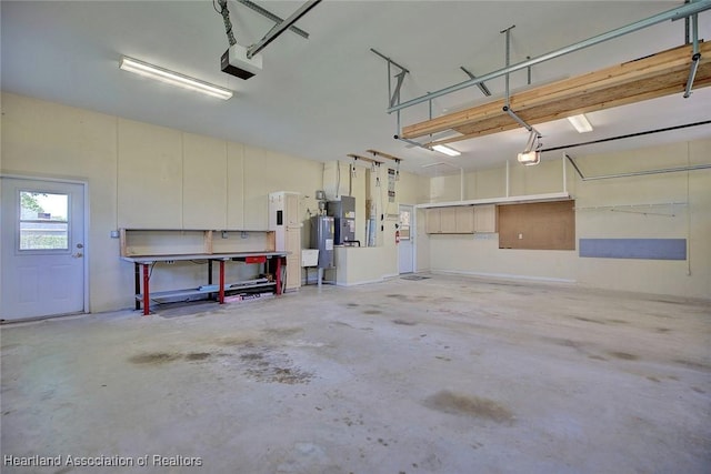 garage featuring a garage door opener and water heater