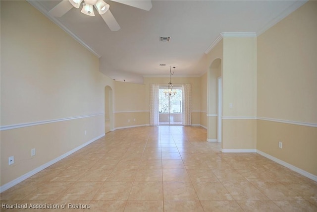 empty room with crown molding, ceiling fan with notable chandelier, and arched walkways