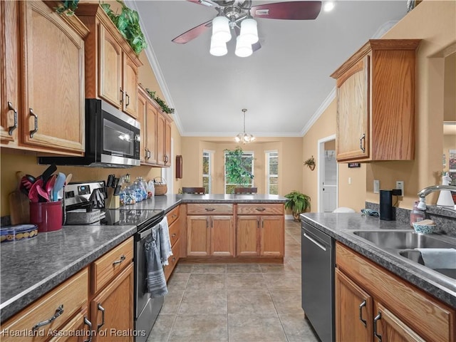 kitchen with lofted ceiling, ceiling fan with notable chandelier, sink, ornamental molding, and stainless steel appliances