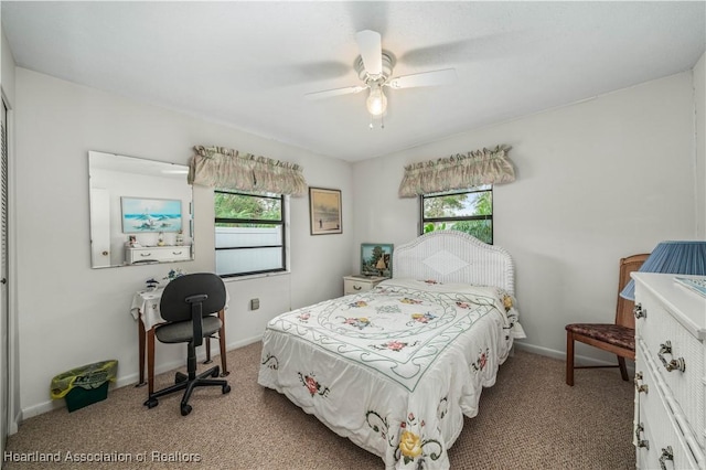 carpeted bedroom with ceiling fan