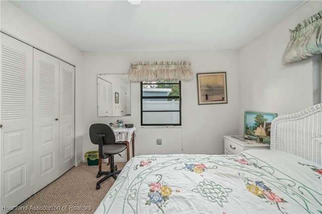 carpeted bedroom featuring a closet