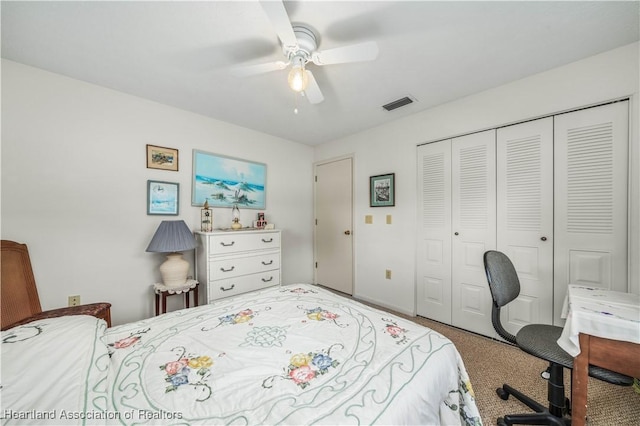 carpeted bedroom featuring ceiling fan and a closet