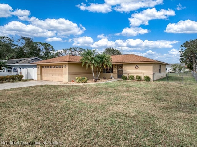 ranch-style house featuring a garage and a front lawn