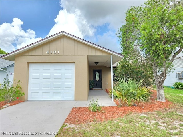 4101 Elson Ave, Sebring, FL 33875 - view of front of property featuring stucco siding, a garage, and concrete driveway