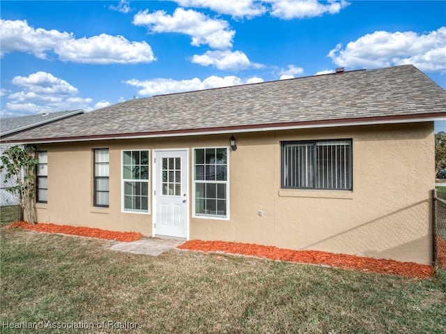 4101 Elson Ave, Sebring, FL 33875 - rear view of property with stucco siding and roof with shingles